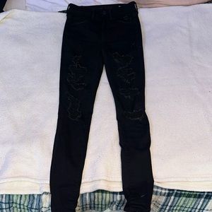 American Eagle black ripped skinny jeans. Size 2 regular, fits xs/s.